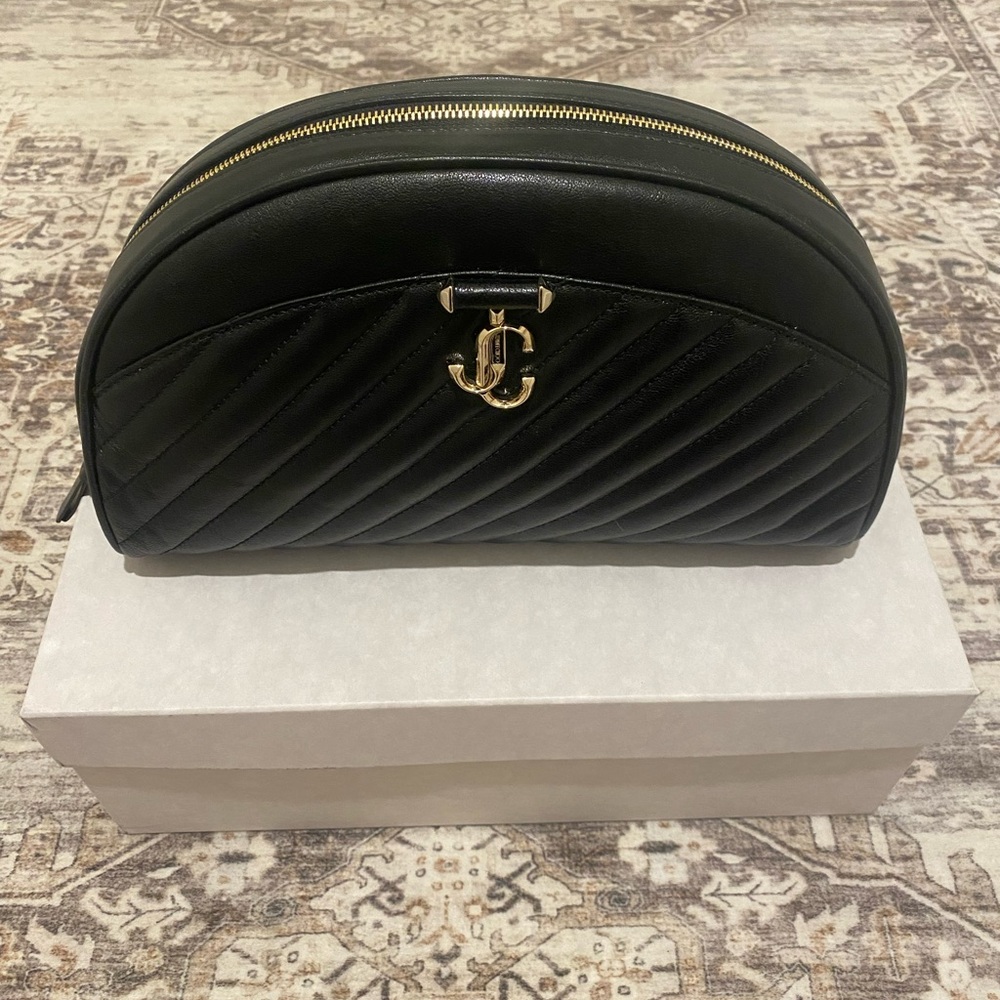 Woman’s Jimmy Choo Black Quilted curved Leather Pouch